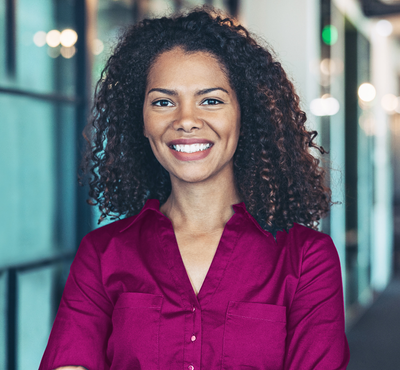 Man & Woman seated on two purple couches 